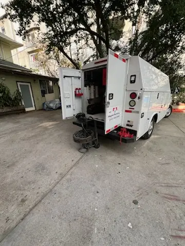 Magnet Plumbing service vehicle on-site for Grease Trap Cleaning in Country Club